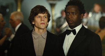 Movie still from “The Double” (2013), directed by Richard Ayoade – Medium shot, Low angle