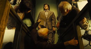 Movie still from “The Double” (2013), directed by Richard Ayoade – Medium shot, Overhead angle