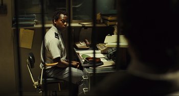 Movie still from “The Double” (2013), directed by Richard Ayoade – Medium shot, Over the shoulder angle