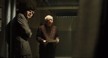 Movie still from “The Double” (2013), directed by Richard Ayoade – Medium shot, Over the shoulder angle