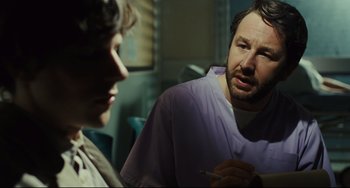 Movie still from “The Double” (2013), directed by Richard Ayoade – Close Up shot, Over the shoulder angle