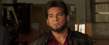 Movie still from “22 Jump Street” (2014), directed by Phil Lord – A person wearing a leather jacket; Close Up shot, Low angle