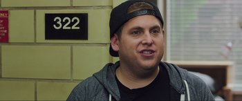 Movie still from “22 Jump Street” (2014), directed by Phil Lord – A person wearing a hat; Close Up shot, Over the shoulder angle