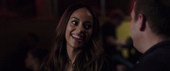 Movie still from “22 Jump Street” (2014), directed by Phil Lord – A person smiling; Close Up shot, Over the shoulder angle