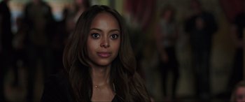 Movie still from “22 Jump Street” (2014), directed by Phil Lord – A beautiful young woman with long brown hair; Close Up shot, Over the shoulder angle