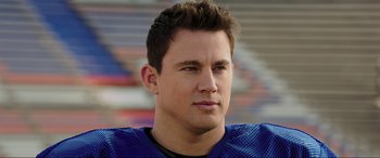 Movie still from “22 Jump Street” (2014), directed by Phil Lord – A football player wearing a blue uniform; Close Up shot, Low angle