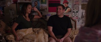 Movie still from “22 Jump Street” (2014), directed by Phil Lord – A man sitting on a bed next to a woman; Medium shot, Over the shoulder angle