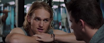 Movie still from “22 Jump Street” (2014), directed by Phil Lord – A man with long blonde hair is looking at another man with long blonde hair; Close Up shot, Over the shoulder angle
