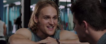 Movie still from “22 Jump Street” (2014), directed by Phil Lord – A person with long blond hair; Close Up shot, Over the shoulder angle