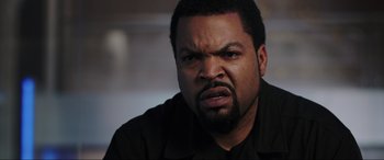 Movie still from “22 Jump Street” (2014), directed by Phil Lord – A man with a beard is looking at the camera; Close Up shot, Over the shoulder angle