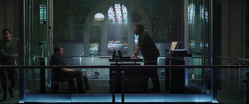 Movie still from “22 Jump Street” (2014), directed by Phil Lord – A man standing in front of a window in a church; Wide shot, Over the shoulder angle
