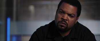 Movie still from “22 Jump Street” (2014), directed by Phil Lord – A person wearing a black shirt; Close Up shot, Over the shoulder angle