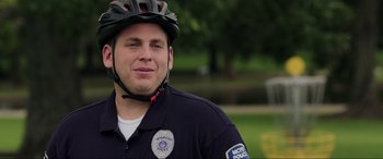 Movie still from “22 Jump Street” (2014), directed by Phil Lord – A police officer wearing a helmet and a uniform; Close Up shot, Over the shoulder angle