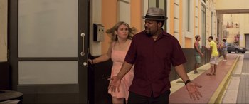 Movie still from “22 Jump Street” (2014), directed by Phil Lord – A man and a woman walking in front of a building; Medium shot, Over the shoulder angle