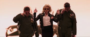 Movie still from “22 Jump Street” (2014), directed by Phil Lord – A group of people standing next to each other; Medium shot, Low angle