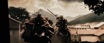 Movie still from “300” (2006), directed by Zack Snyder – Two people on horseback riding through the desert; Wide shot, Low angle
