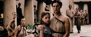 Movie still from “300” (2006), directed by Zack Snyder – A woman and a young girl are posing for a picture; Medium shot, Low angle