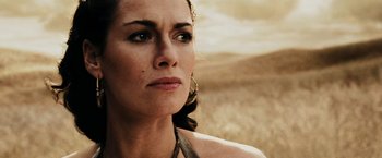 Movie still from “300” (2006), directed by Zack Snyder – A person wearing a necklace; Close Up shot, Over the shoulder angle