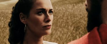 A woman's face in a grassy area