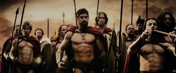 Movie still from “300” (2006), directed by Zack Snyder – A group of men in ancient roman garb marching; Medium shot, Low angle