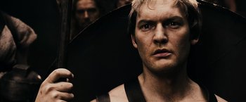 Movie still from “300” (2006), directed by Zack Snyder – A person holding an umbrella; Close Up shot, Low angle