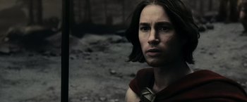 Movie still from “300” (2006), directed by Zack Snyder – A person with long brown hair; Close Up shot, Low angle
