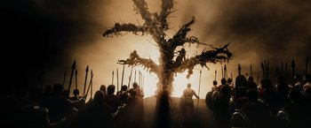 Movie still from “300” (2006), directed by Zack Snyder – A group of people standing around a tree; Wide shot, Low angle