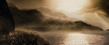 Movie still from “300” (2006), directed by Zack Snyder – A flock of birds flying over a body of water; Extreme Wide shot, High angle