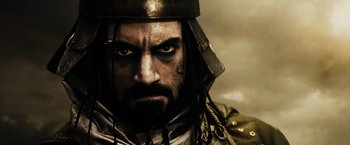 Movie still from “300” (2006), directed by Zack Snyder – A person wearing a helmet; Close Up shot, Low angle