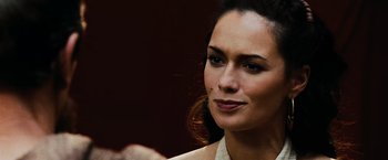 Movie still from “300” (2006), directed by Zack Snyder – A woman's face in a dark room; Close Up shot, Over the shoulder angle