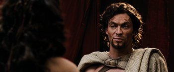 Movie still from “300” (2006), directed by Zack Snyder – A person with a beard looking in a mirror; Close Up shot, Over the shoulder angle