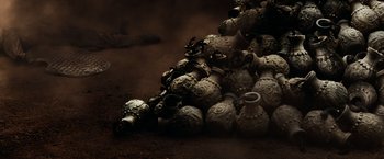 Movie still from “300” (2006), directed by Zack Snyder – A pile of vases sitting on top of each other; Extreme Close Up shot, Overhead angle