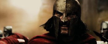Movie still from “300” (2006), directed by Zack Snyder – A person wearing a helmet; Close Up shot, Low angle