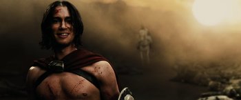 Movie still from “300” (2006), directed by Zack Snyder – A man in a red robe with blood all over his body; Close Up shot, Low angle