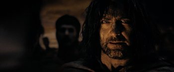 Movie still from “300” (2006), directed by Zack Snyder – A person with long hair; Close Up shot, Over the shoulder angle