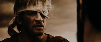 Movie still from “300” (2006), directed by Zack Snyder – A person with a blindfold on; Close Up shot, Low angle
