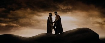 Movie still from “300” (2006), directed by Zack Snyder – A couple of men standing on top of a hill; Wide shot, Low angle