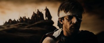 Movie still from “300” (2006), directed by Zack Snyder – A person wearing a blindfold; Close Up shot, Low angle