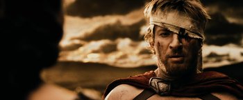 Movie still from “300” (2006), directed by Zack Snyder – A person with a helmet on; Close Up shot, Low angle
