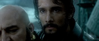 Movie still from “300: Rise of an Empire” (2014), directed by Noam Murro – A person holding a sword; Close Up shot, Over the shoulder angle