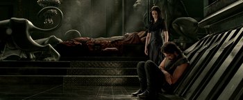 Movie still from “300: Rise of an Empire” (2014), directed by Noam Murro – A man and a woman sitting on the steps of a staircase; Wide shot, High angle