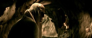 Movie still from “300: Rise of an Empire” (2014), directed by Noam Murro – An old man with a beard is wearing a robe; Medium shot, Low angle