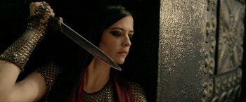 Movie still from “300: Rise of an Empire” (2014), directed by Noam Murro – A woman holding a knife in front of her face; Close Up shot, Low angle