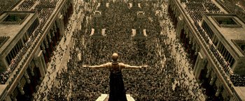 Movie still from “300: Rise of an Empire” (2014), directed by Noam Murro – A man standing in front of a wall filled with bats; Extreme Wide shot, High angle