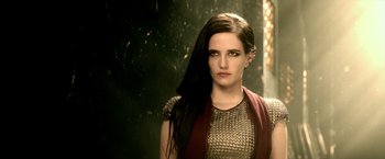 Movie still from “300: Rise of an Empire” (2014), directed by Noam Murro – A woman with long black hair wearing a gold dress; Close Up shot, Over the shoulder angle