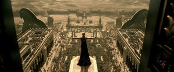 Movie still from “300: Rise of an Empire” (2014), directed by Noam Murro – An image of a woman standing on top of a building; Extreme Wide shot, High angle