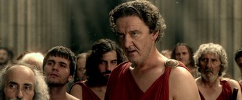 Movie still from “300: Rise of an Empire” (2014), directed by Noam Murro – A person wearing a red shirt; Close Up shot, Low angle