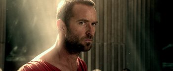 Movie still from “300: Rise of an Empire” (2014), directed by Noam Murro – A person wearing a red shirt; Close Up shot, Over the shoulder angle