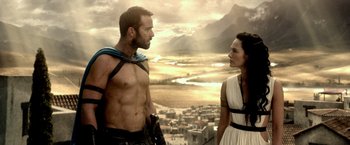 Movie still from “300: Rise of an Empire” (2014), directed by Noam Murro – A man and a woman standing next to each other on top of a hill; Medium shot, Over the shoulder angle