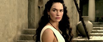 Movie still from “300: Rise of an Empire” (2014), directed by Noam Murro – A woman with long black curly hair wearing a white dress; Close Up shot, Over the shoulder angle